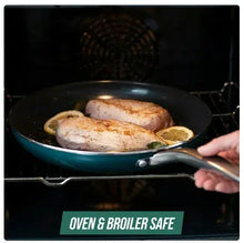Teal non-stick skillet with food inside, in an oven