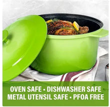 Green Dutch oven pot with lid open and handle, black interior, safety feature icons