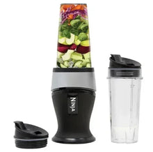 Personal blender with black base, Ninja cup, and two 16-oz travel containers
