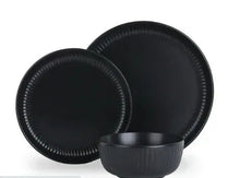 Black stoneware dinner plates and bowl set, ribbed rim detail