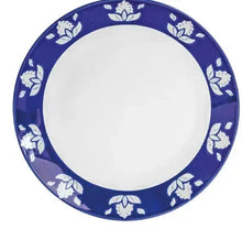 Indigo blue round dinner plate with white floral rim and empty center