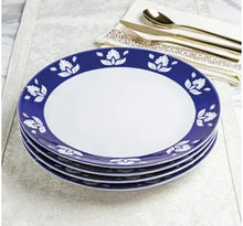 Indigo blue stoneware dinner plate set with white floral rim, stacked plates