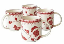 Set of four stoneware mugs in off-white with red leaf and berry pattern, curved handles