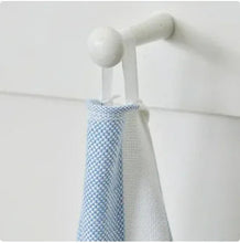 Striped beach towel with fringe edge, hanging close-up