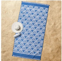 Oversized navy beach towel with white fan sunburst print and fringed border