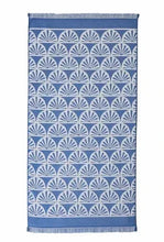 Oversized navy beach towel with white fan sunburst pattern and fringed edge