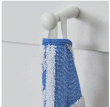 Navy beach towel corner with grommet, white fan print, and blue stitched border