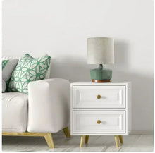 Ceramic table lamp with teal-green base and beige drum fabric shade.
