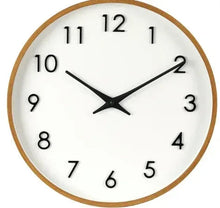 Round analog wall clock, mid-tone wood frame, white dial, black hands and numerals