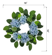 18 in hydrangea wreath with light blue blooms and green leaves, circular shape.