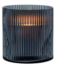 Ribbed smoke glass hurricane candle holder, open top with warm light through