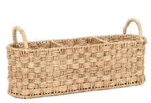 Beige oval rattan caddy with two loop handles and woven basket sides