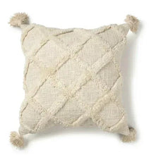 Square throw pillow with tufted trellis pattern and corner tassels, natural