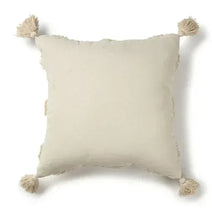 Square throw pillow with solid natural fabric and corner tassels