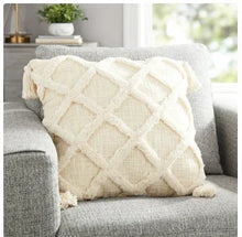Square throw pillow with tufted trellis texture and fringed corner tassels