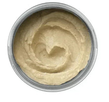 Reusable glass condiment container with pale beige contents and silver rim lid