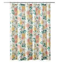 Floral shower curtain panel with pink roses and green leaves, held by metal rod