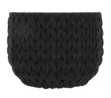 Black woven storage basket with closed-knit texture and wide open top