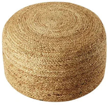 Woven jute pouf in natural tan, cylindrical shape with textured surface