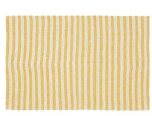 Striped layering rug with yellow and white vertical bands, flat woven texture