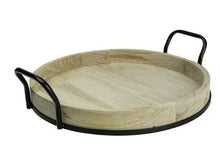 Round light wood serving tray with black metal handles and shallow interior