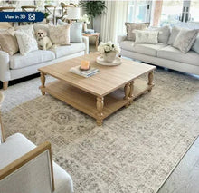 Tan 2 ft x 3 ft area rug with abstract distressed pattern