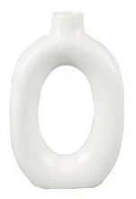 White ceramic donut vase with circular cutout, glossy finish, arched top.