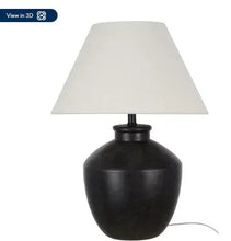 Black urn table lamp with white shade on black stem base
