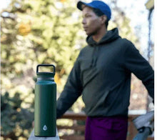 Green stainless steel water bottle with black lid and carry handle
