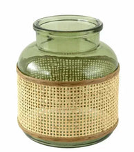 Translucent green glass tabletop vase with natural rattan caning wrap
