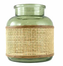 Green glass tabletop vase with natural rattan caning wrap and round base