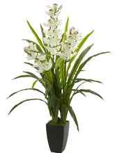 Artificial cymbidium orchid plant with white blooms and green leaves in dark pot