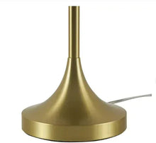 Brass table lamp base with wide pedestal and visible power cord