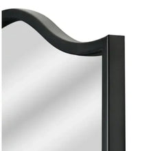 Arched mirror frame corner detail in black with curved top glass edge