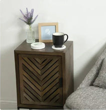 Artificial lavender stems in ribbed glass vase on tabletop