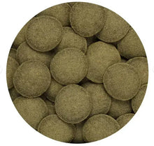 Green algae wafers, round pellets in a bowl