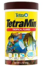 TetraMin tropical flakes fish food container with fish on yellow label