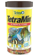 TetraMin XL tropical fish food flakes jar with front label and fish graphics