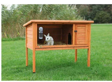 Wooden elevated small animal hutch with side door and wire enclosure, brown