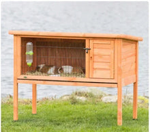 Wooden elevated small animal hutch, side view, open front with wire enclosure, brown