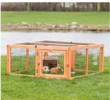 Outdoor small animal cage and run extension with brown wood frame and wire mesh walls