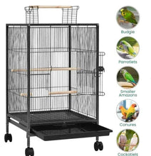 Black wire bird cage with two wooden perches and front door, on caster wheels