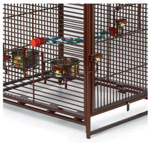 Bird cage interior with wire grid walls, hanging feeders, and bar perches