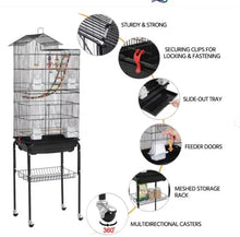 Metal bird cage with secure clips, feeder doors, storage rack, and locking casters