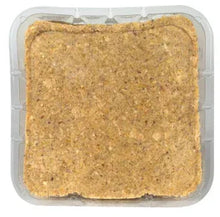 Square tan suet dough cake in clear plastic tray for wild birds