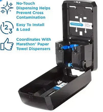 Black automated soap dispenser with open cover showing pump and soap reservoir tray