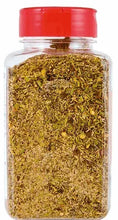 Caribbean jerk seasoning blend in clear jar, finely chopped herbs.
