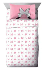 Minnie Mouse bed set: pink pillow and white-gray sheet with pink bow pattern