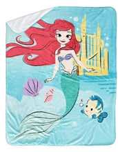 Blue faux fur throw blanket with Ariel mermaid artwork, shells, and castle detail