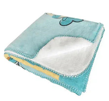 Light blue faux fur throw blanket with cloud motif and white plush interior